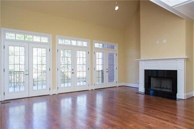 THREE SET'S OF FRENCH AND THE FIREPLACE ARE THE FOCAL POINT OF THIS GREAT RM. NOTICE THE GLEAMING HARDWOOD FLOORS.