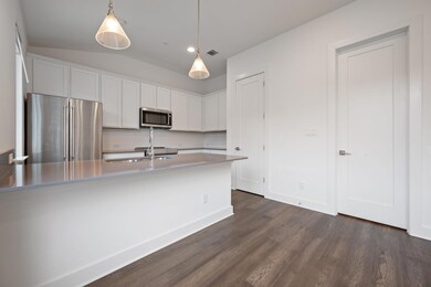 Kitchen featuring stainless steel appliances, dar