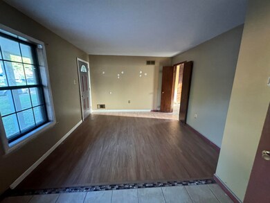 Unfurnished room with hardwood / wood-style floori