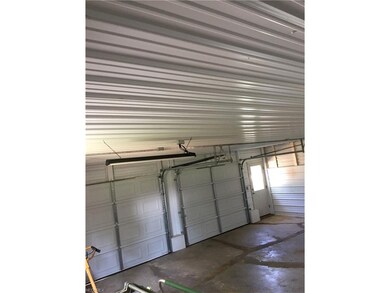 2 Car garage with new doors and steel walls/ceiling.