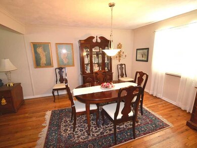 Exterior Front. Large dining room with warm rich r
