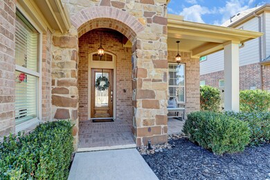 The welcoming front door contains leaded glass and this home has a ring doorbell for safety and Smart home features. This front door lock can be used with voice and iPhones.