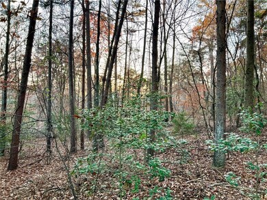 View of landscape featuring a view of trees