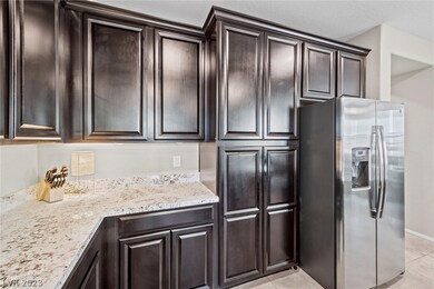 Dark raised panel Espresso cabinetry with soft clo