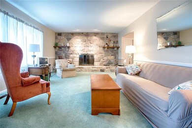 First floor Living Room with beautiful fireplace.