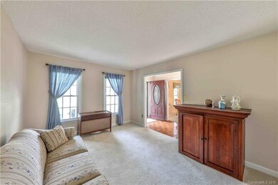 Living room with two large windows looking out on 