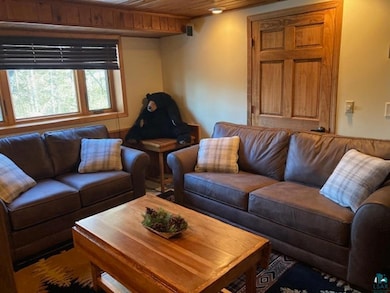 Living area with wood ceiling