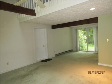 Open living room with cathedral ceiling.