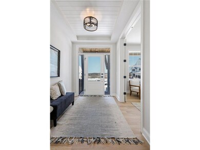 Spacious foyer with shiplap vault