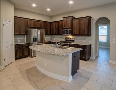 Kitchen featuring stainless steel appliances, arc