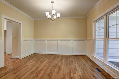 The dining room is enhanced by beautiful wainscoti