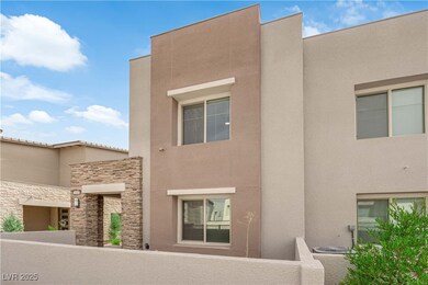 View of front of home with stone siding and stucco