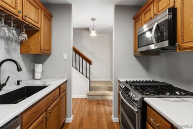 Kitchen featuring upscale gas range, stainless mic