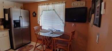 Kitchen featuring stainless steel refrigerator wit