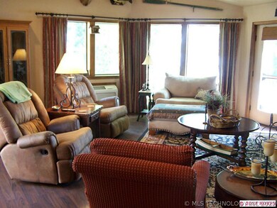 1 of the living areas with lake view and fireplace