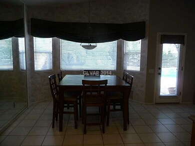 Property Photo. Dining area looking out to pool an