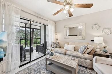 Tiled living room featuring ceiling fan and a text
