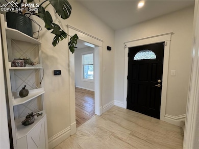 The view from the kitchen into the foyer