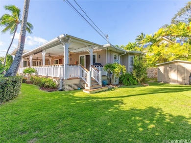 Huge covered lanai flows to a spacious yard area.