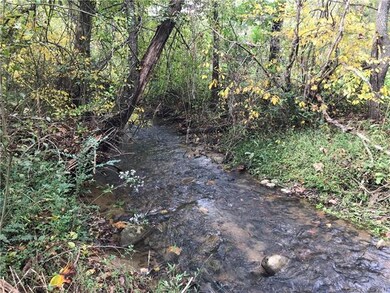 Ox Creek runs under the driveway bridge