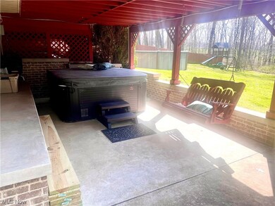 Ground level patio area with hot tub area