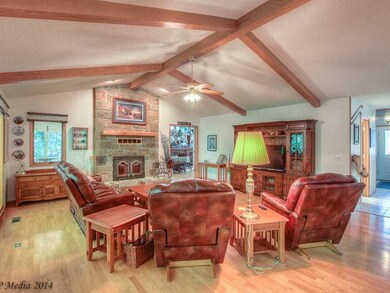 Living Room. Floor To Ceiling Stone Fireplace And