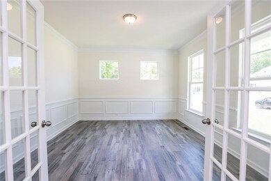 The bright and private office features french door