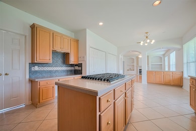 This spacious kitchen features abundant storage, i