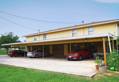 View of front of home featuring brick siding