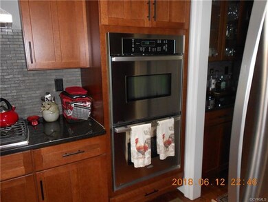 Kitchen double oven and cooktop.