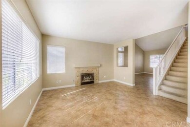 Cozy fireplace with custom tile work accents the f