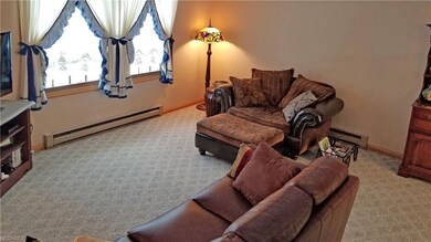 The living room has double views of the front and 
