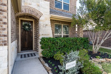 Let's venture up the sidewalk to a charming wood door w/glass inserts allowing in natural light!