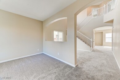 Spare room with carpet flooring, stairway, baseboa