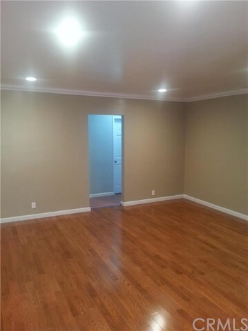 Living room with beautiful hardwood floors (not la