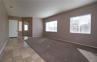 Entry opens to the living and dining room; Tiled flooring keeps carpet in great condition