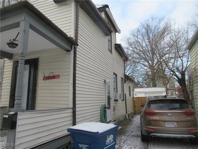 View of side of property featuring cooling unit