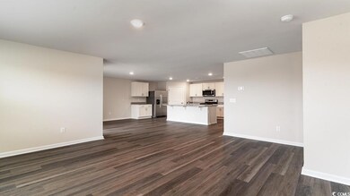 Unfurnished living room with dark hardwood / wood-