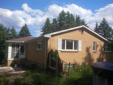 Left side view and sunroom entrance