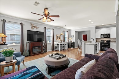 Living room featuring light wood finished floors, 