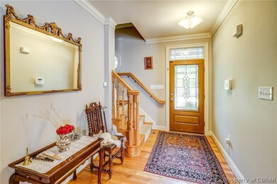 Welcoming hall. Trim details and lovely floors. St