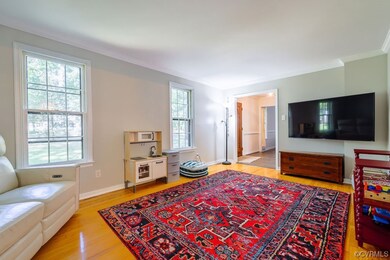 Living Room with Crown molding, healthy amount of