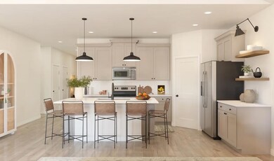 Kitchen with pendant lighting and floating shelves