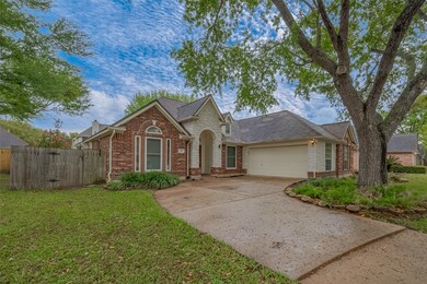 Charming single-story brick home with a two-car ga