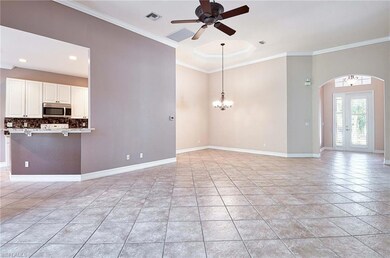 Foyer to a spacious living room.