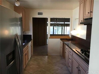 Kitchen opens to dining area