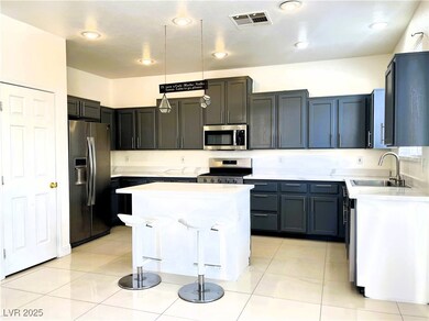 Kitchen featuring stainless steel appliances, ligh