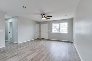 Spare room featuring light hardwood / wood-style f