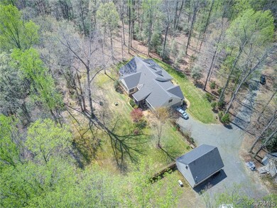 Aerial View of the House and Detached Garage/Works