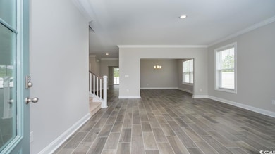 Entrance foyer featuring a notable chandelier, cro